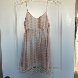 White and tan mini dress with white lace at the end, size medium